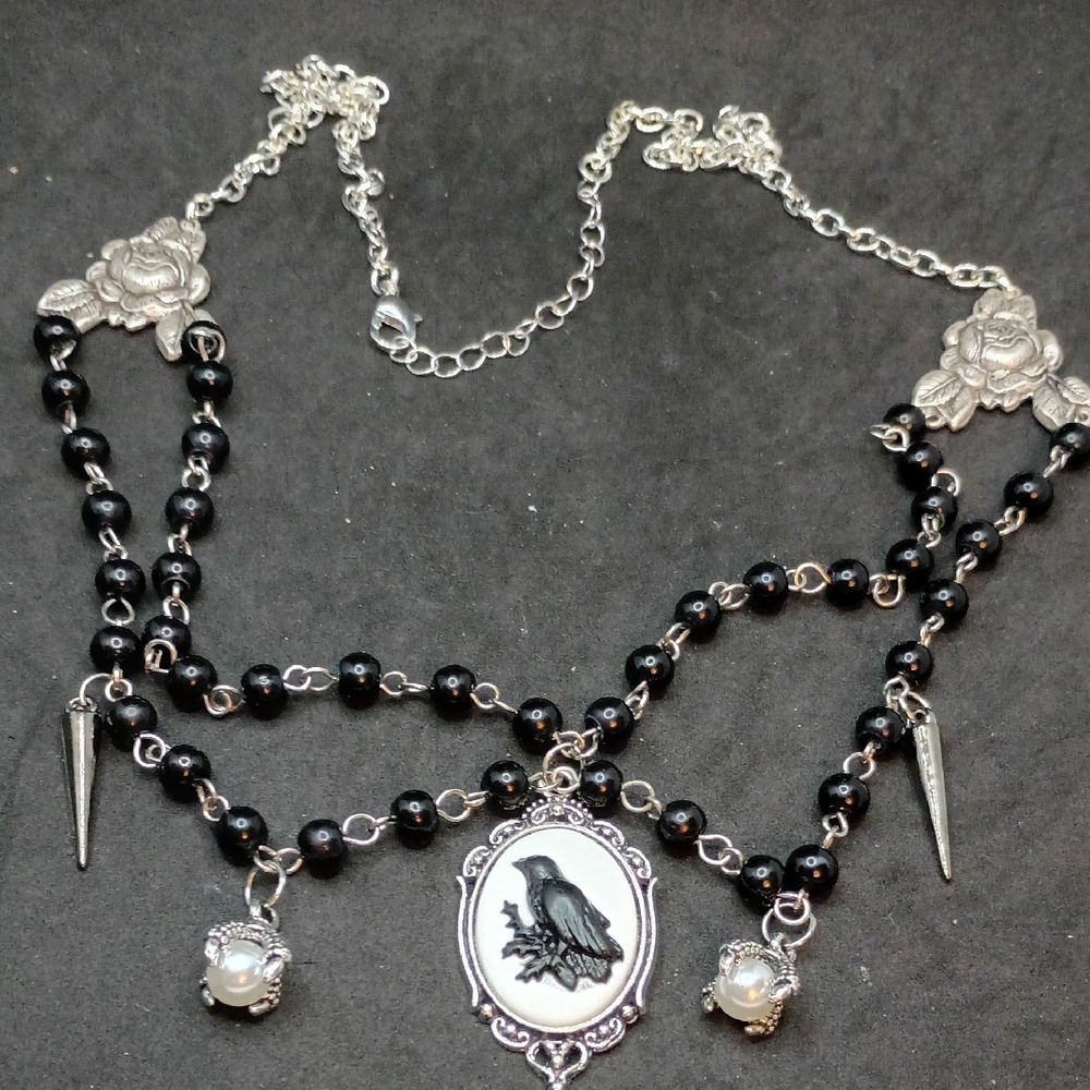 Elegant Black and Silver Necklace with Raven Pendant